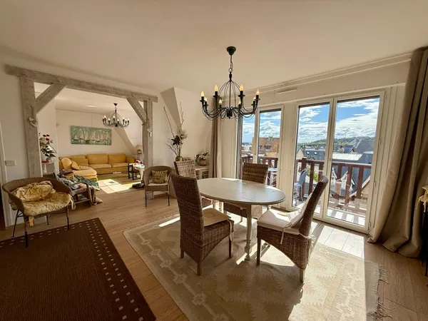 En plein centre ville au dernier étage appartement de 4/5 pièces avec 2 balcons et très belle vue dé