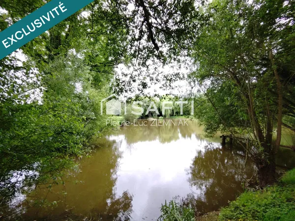 Terrain de loisirs avec étang et mobil-home  4100 m² clos à Houssay (53360)