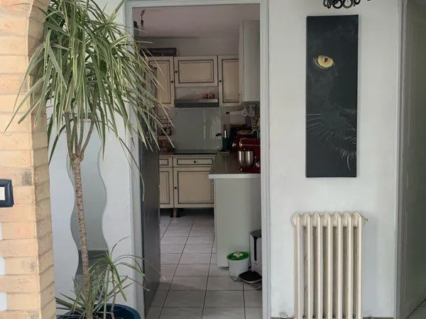 Maison 4 faces grand garage avec jardin 