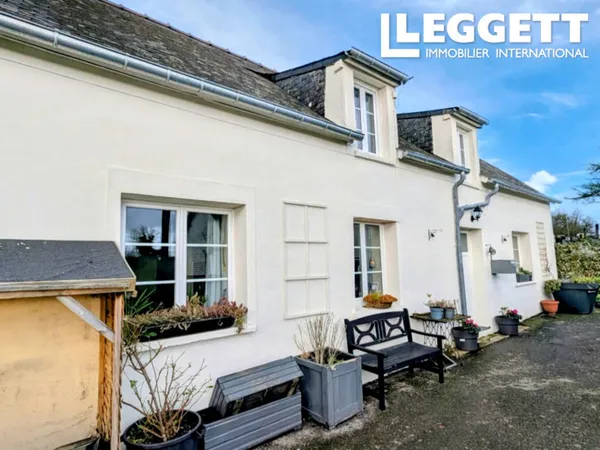 Charmante longère mitoyenne de 3 chambres avec caractère et cour, située dans un village 