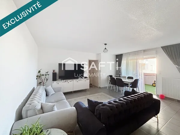 Appartement avec balcon, ascenseur et place de parking 