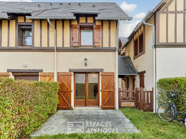 Cottage en triplex avec son jardin 
