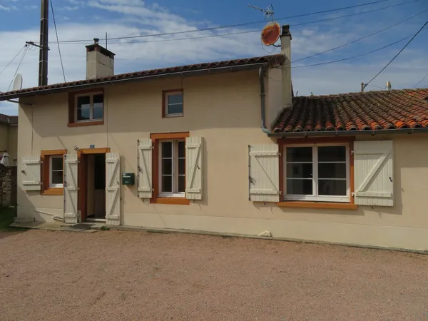 Maison en pierre avec véranda, 2 garages, une grange et jard 
