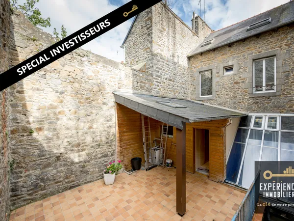 Immeuble avec local commercial dans le centre 