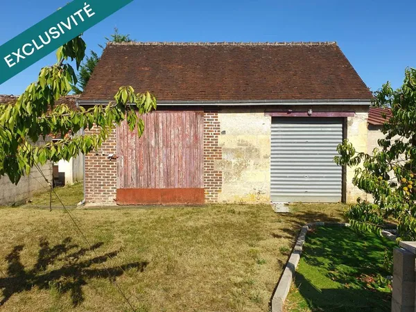 Grange à aménager dans un village 