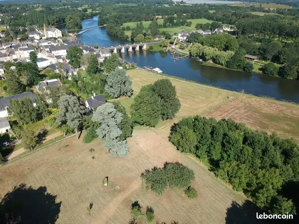 Terrain avec vue rivière et cadre exceptionnel en coeur de ville (11 000 m2 dont 867 m2 