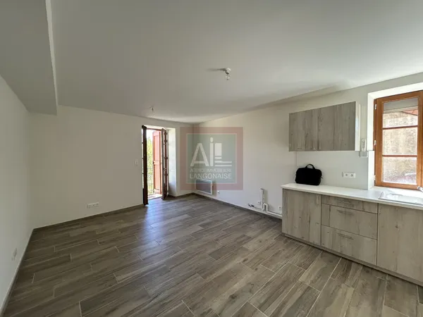 Appartement en rez-de-chaussée avec balcon 