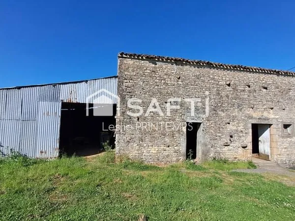 Grange à rénover sur 1500 m² de terrain constructible