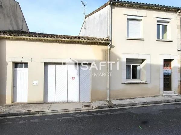 Maison de bourg avec garage et grand atelier