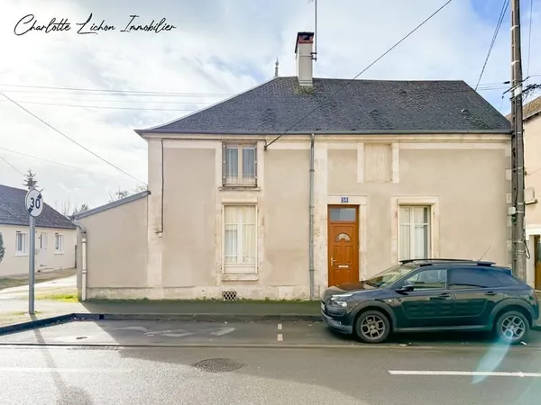 Maison de 90 m2 - 2 chambres - 158 m2 au sol - cave - garage - jardin de 100 m2