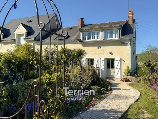 Maison de caractère avec joli jardin.