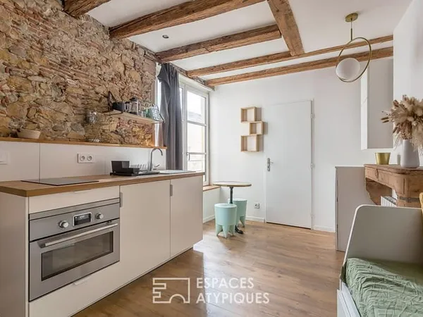 Studio rénové avec pierres apparentes au coeur de Saint-Paul