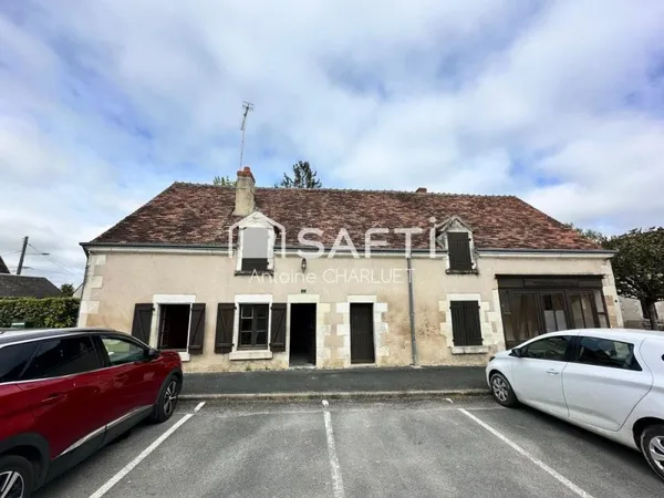 Maison avec beau potentiel locatif.
