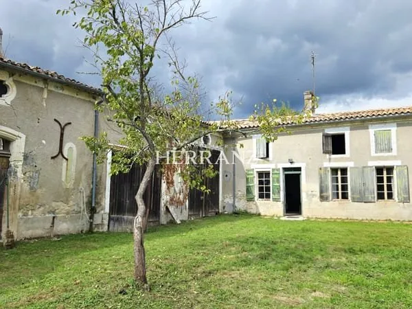 Ensemble immobilier avec maison, grange et dépendances En
