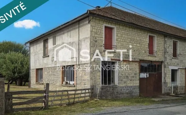 Maison d'habitation avec grand garage en-dessous, plusieurs dépendances, grand terrain.