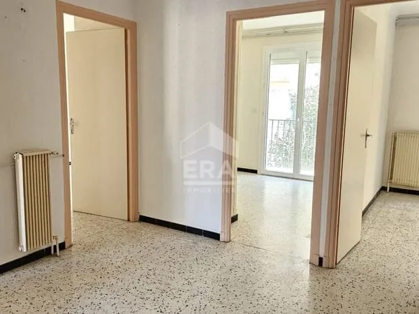 À vendre à Perpignan : Appartement 3 chambres, garage, cave, balcons et jardin