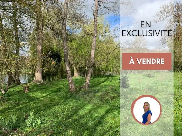 Magnifique terrain de loisirs arboré au bord de l'Eure ! à 2 mn d' Anet