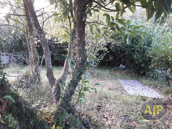 TERRAIN A BATIR + GARAGE ET ATELIER