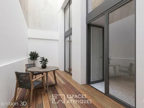 Loft en plateau à rénover avec cour privative