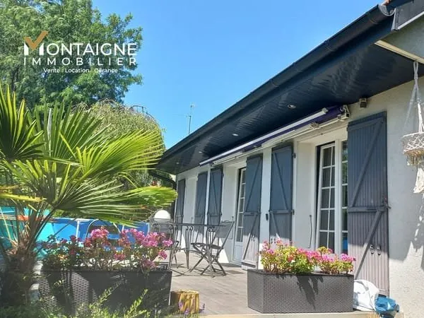 Maison familiale 3 chambres avec studio indépendant et garage.