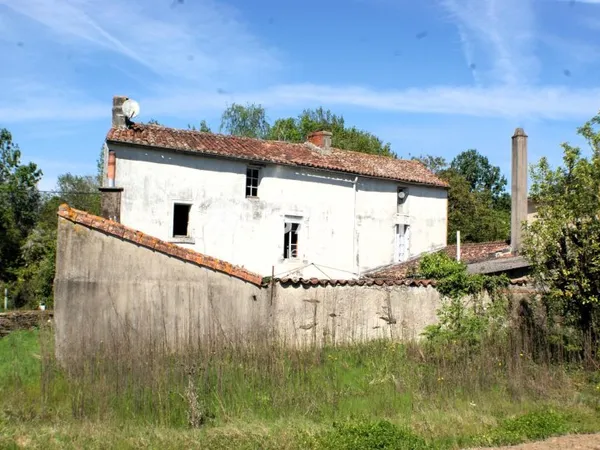 Ensemble de 2 maisons et un terrain constructible