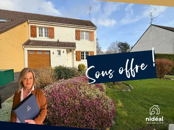 Maison mitoyenne par le garage