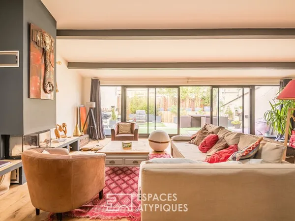 Loft industriel avec grand garage et terrasse plein Ouest