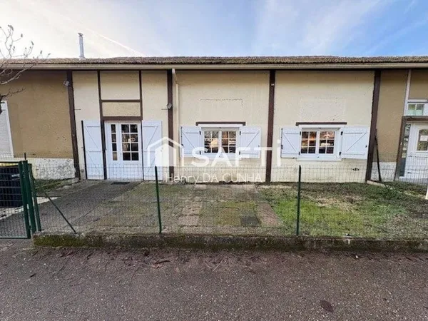 Maison de ville mitoyenne plain-pied avec jardin