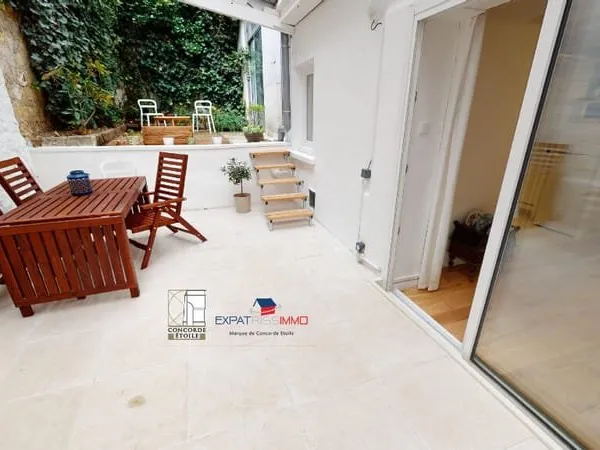 Duplex 3 pièce(s) 65.22 m2 Paris 14ème arrondissement terrasse ouverte véranda