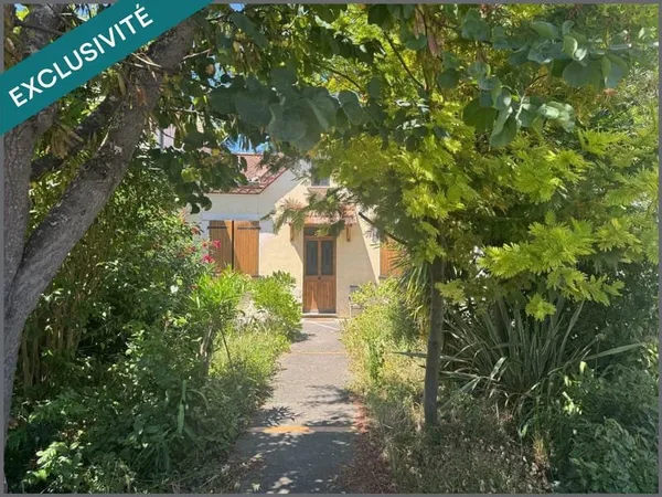 Maison avec garage et jardin