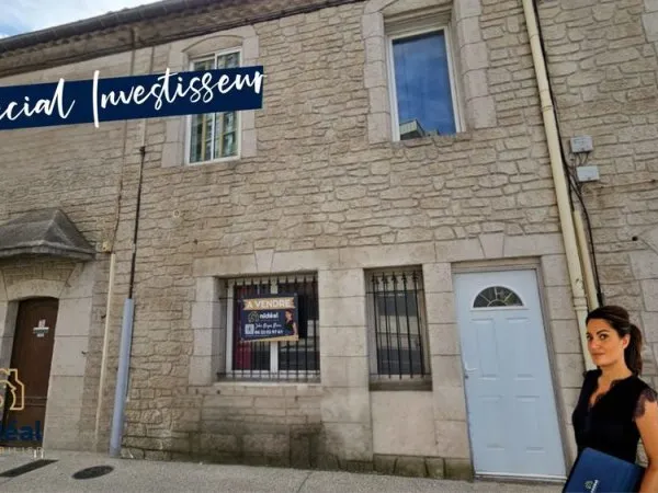 Maison de ville avec terrasse et commerce