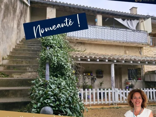 Maison composée de 2 appartements loués + caves, parkings et