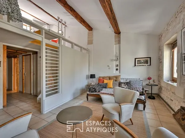 Appartement de type loft avec terrasse sur les toits