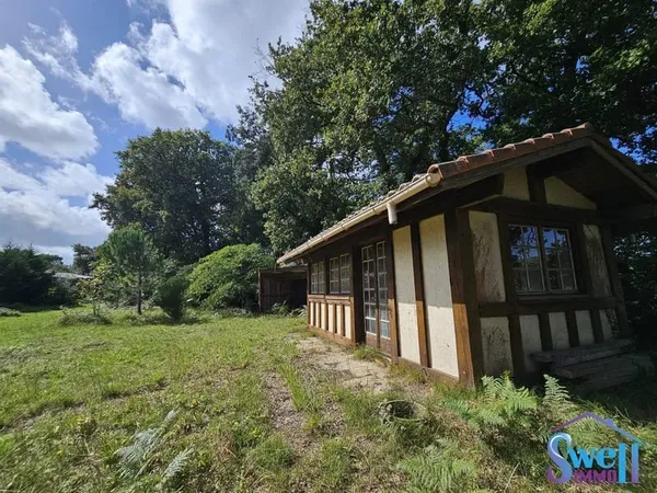 Terrain à bâtir de 1072m² plat, en partie clos, viabilisé pr