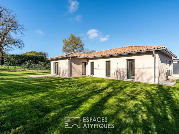 Maison neuve avec jardin et garage