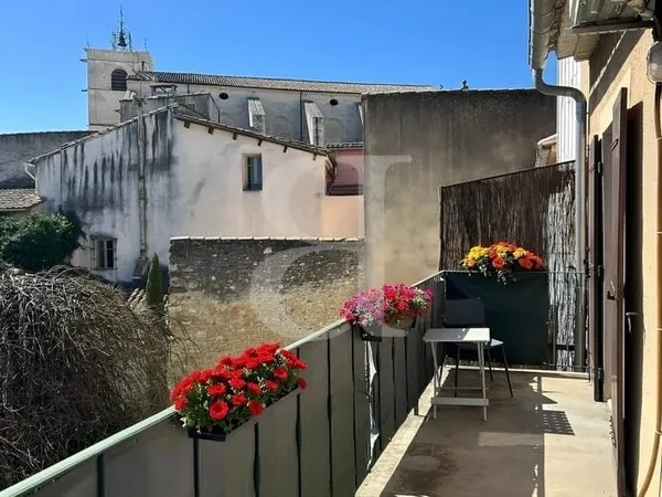 Appartement avec balcon et jardin commun en plein centre ville d