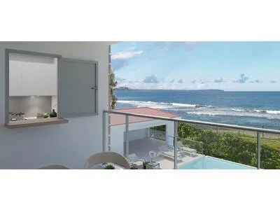 A VENDRE appartement T3 face piscine et face mer en RDC à Moule