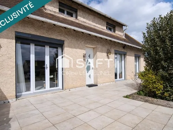 Maison familiale avec jardin, sous-sol total et beaux volumes