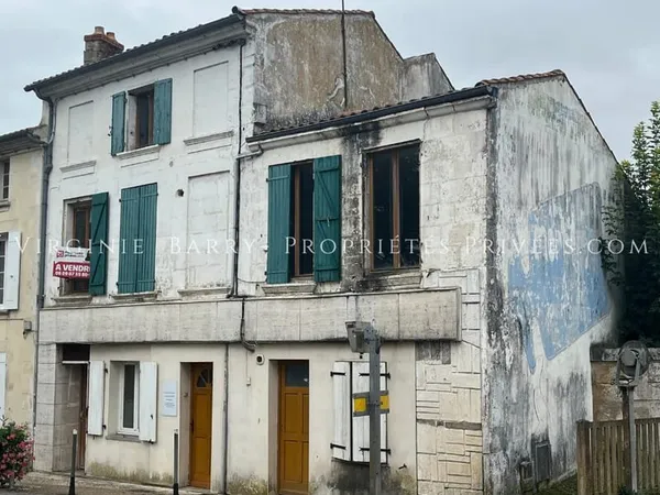 IMMEUBLE COMPOSE DE 4 APPARTEMENTS ET 1 MAISON AVEC JARDIN