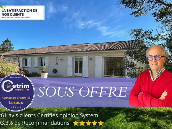 Maison d'habitation avec garage double et jardin arboré sur une parcelle de 1.500 m2