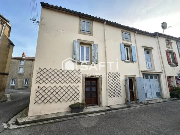 Grande maison de village avec garage et jardin