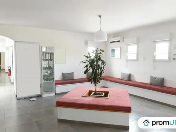 Local professionnel loué 405 m² avec habitation 107 m²