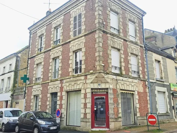 Immeuble 265m² compsé de 4 lots avec jardin