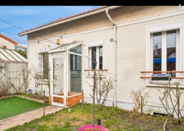 Maison avec garage et jardin