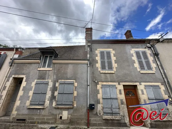 Immeuble de 2 appartements + un local commercial