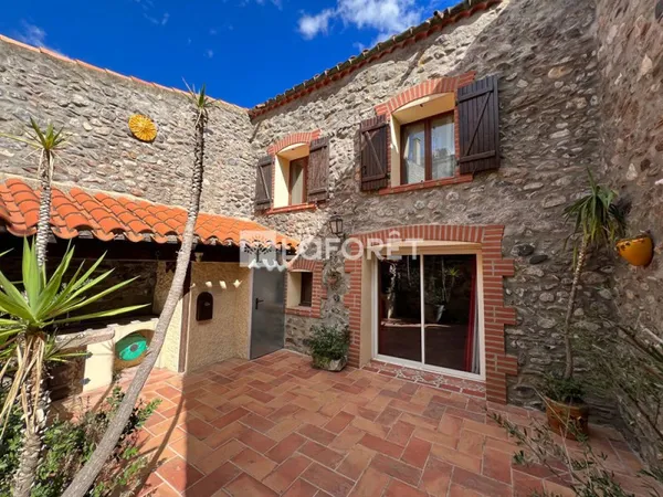 Maison avec garage et terrasses