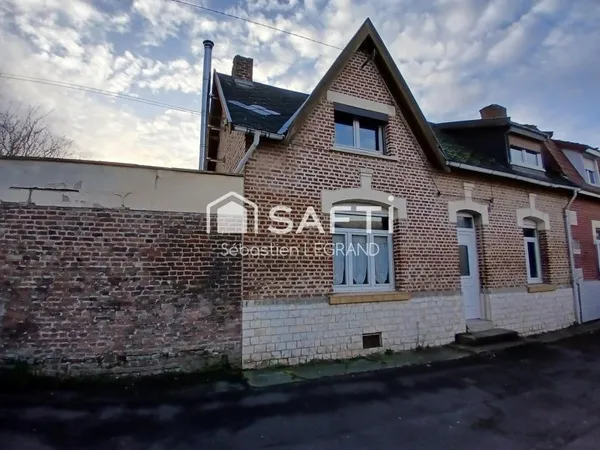 Maison 4 chambres avec jardin, garage et cave.
