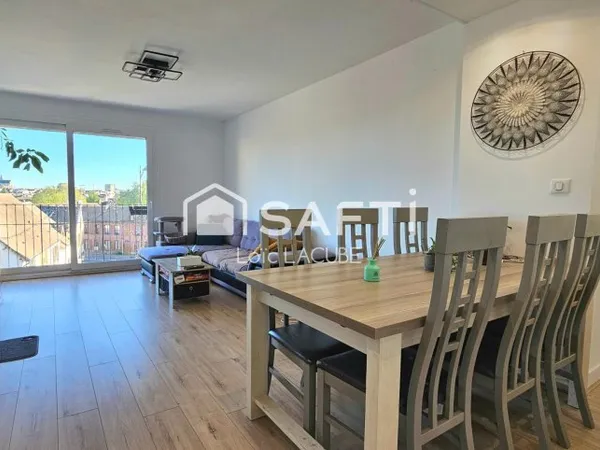 Appartement 75m2 avec grand jardin, garage et 2 parkings+ cave.