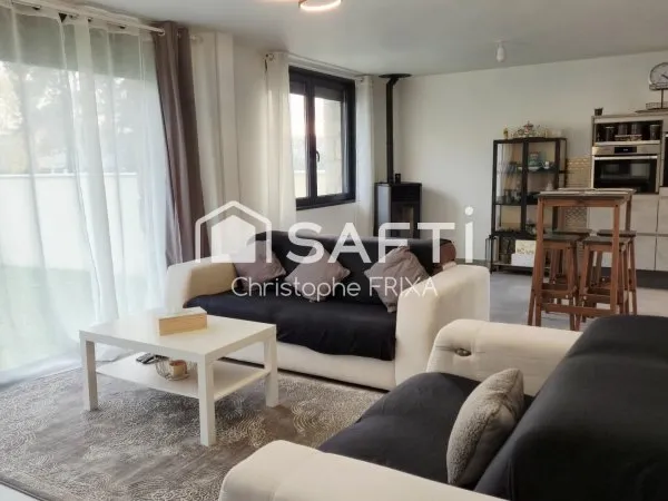Maison mitoyenne entièrement rénovée avec garage et jardin, idéale famille