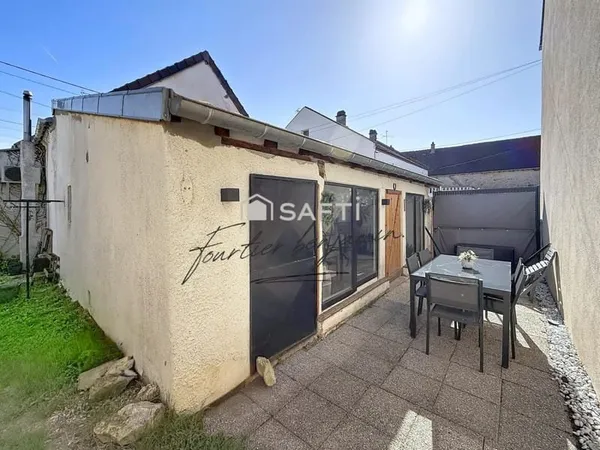 Maison avec jardin, garage et 3 chambres